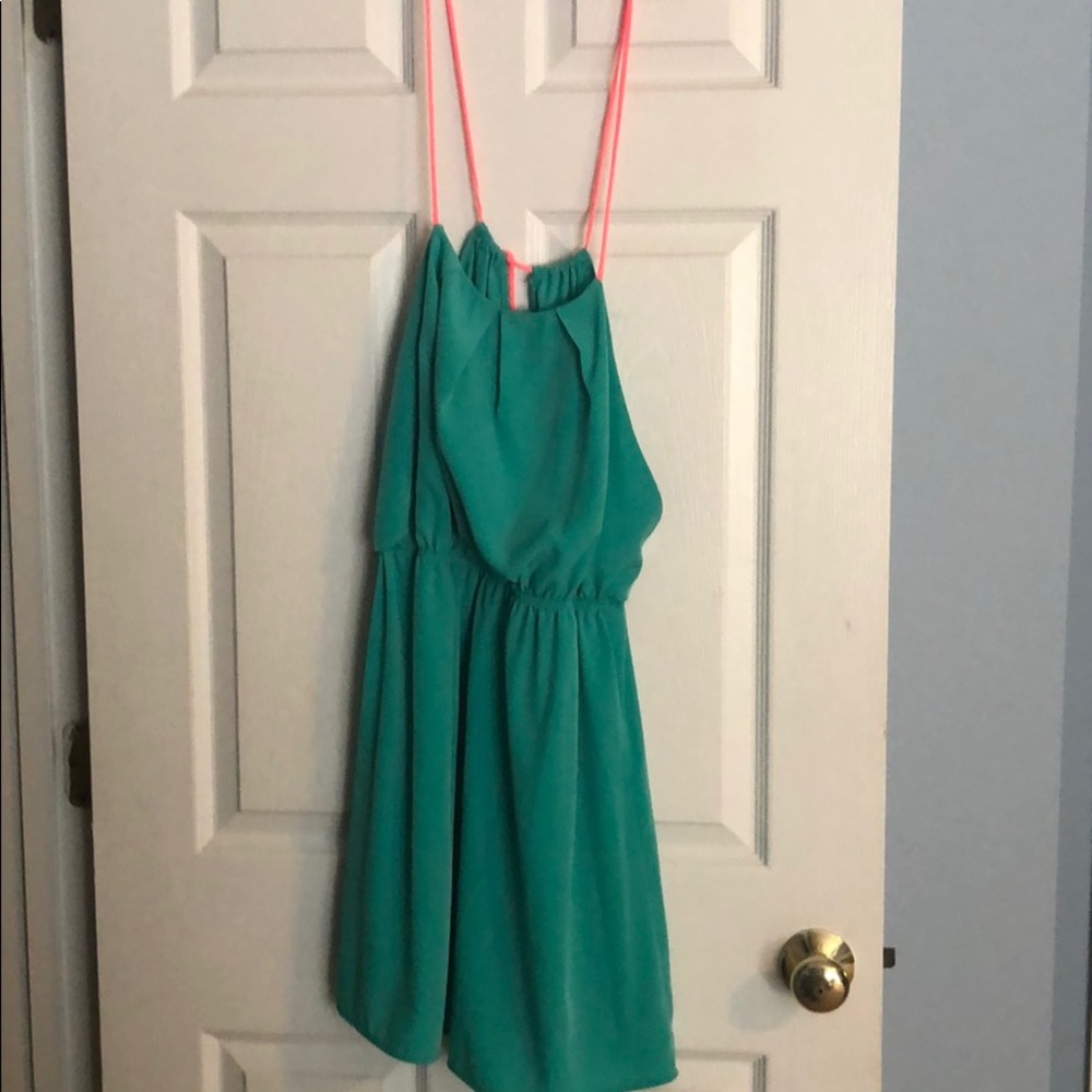 Gently used mint green with coral straps dress.
